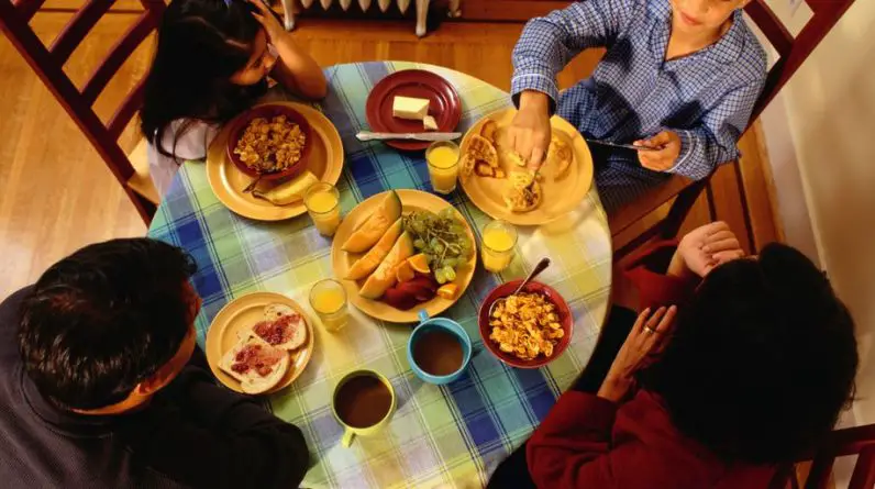 family dinner table with healthy food
